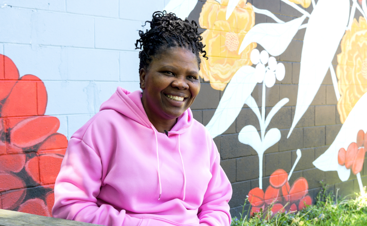 Alma Allen is photographed smiling outside of a coffee shop in Staunton, VA